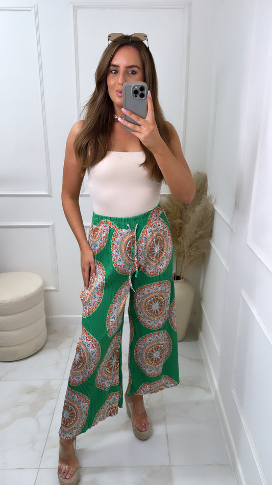 ARIA green circle print trousers