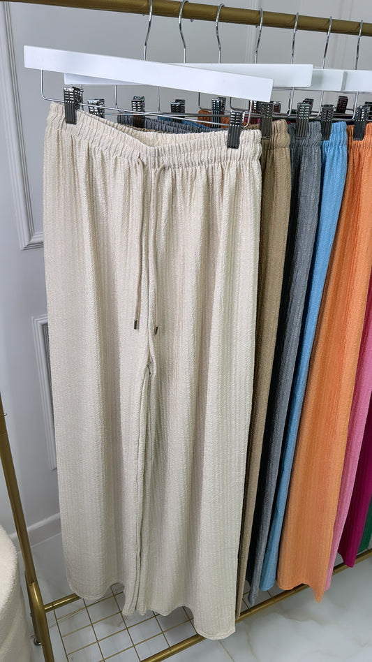 LOLA beige textured wide leg trousers